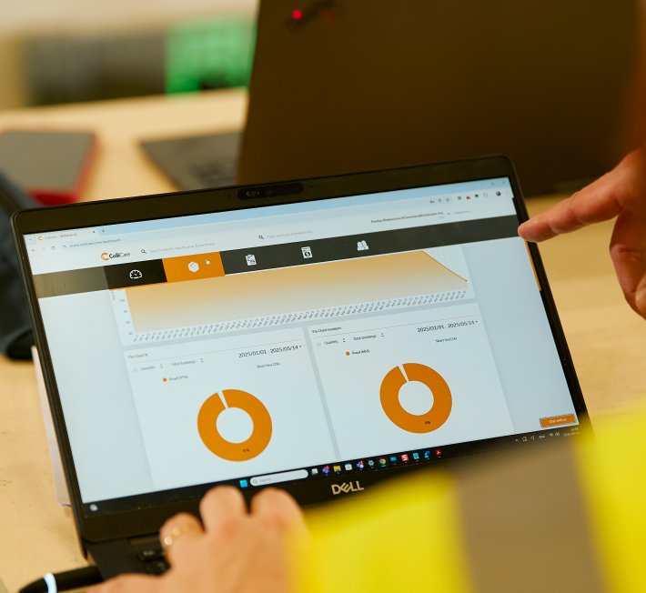 working on PC in China warehouse and WMS system dashboard