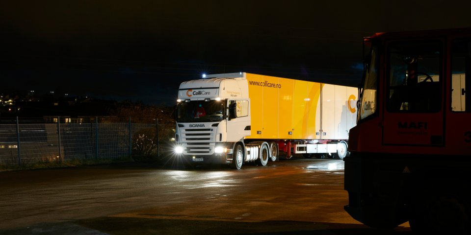 Branded ColliCare trailer during night, ready to deliver predictable goods